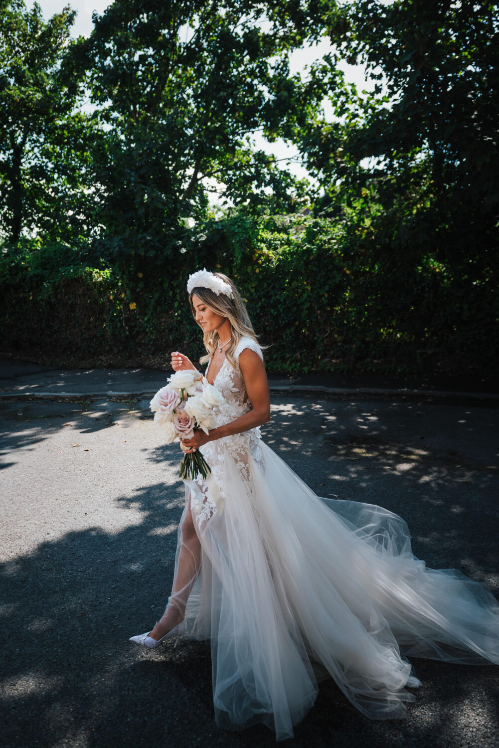 A Bride Carrying Flowers On The Way To The Church