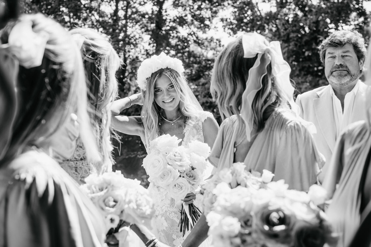 A Black and White Photograph of A Bride Entering The Church