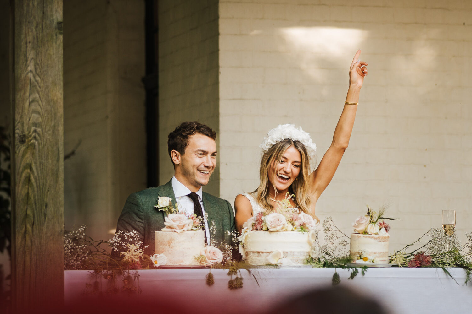 Lily and Jack cutting their wedding cake