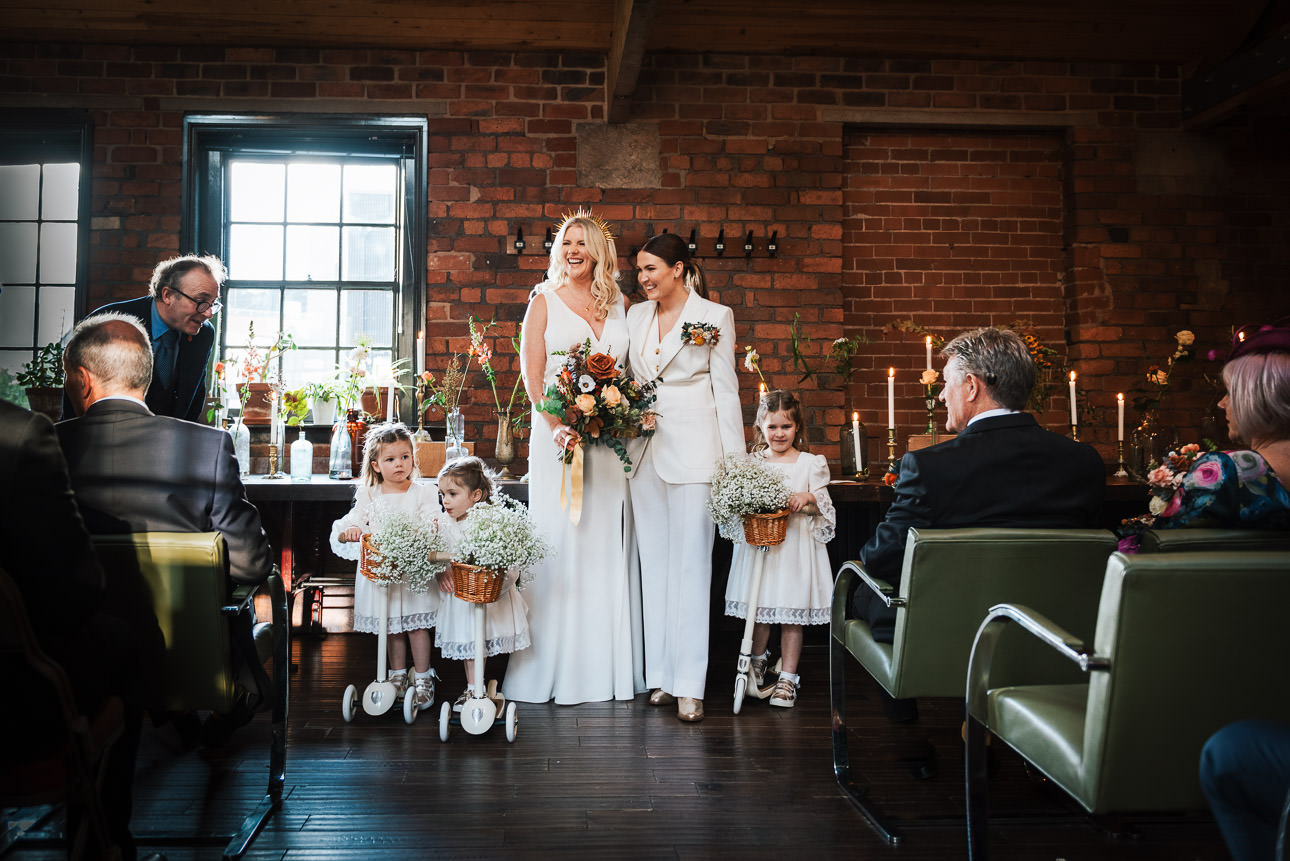A same sex couple saying their wedding vows in The Chimney House