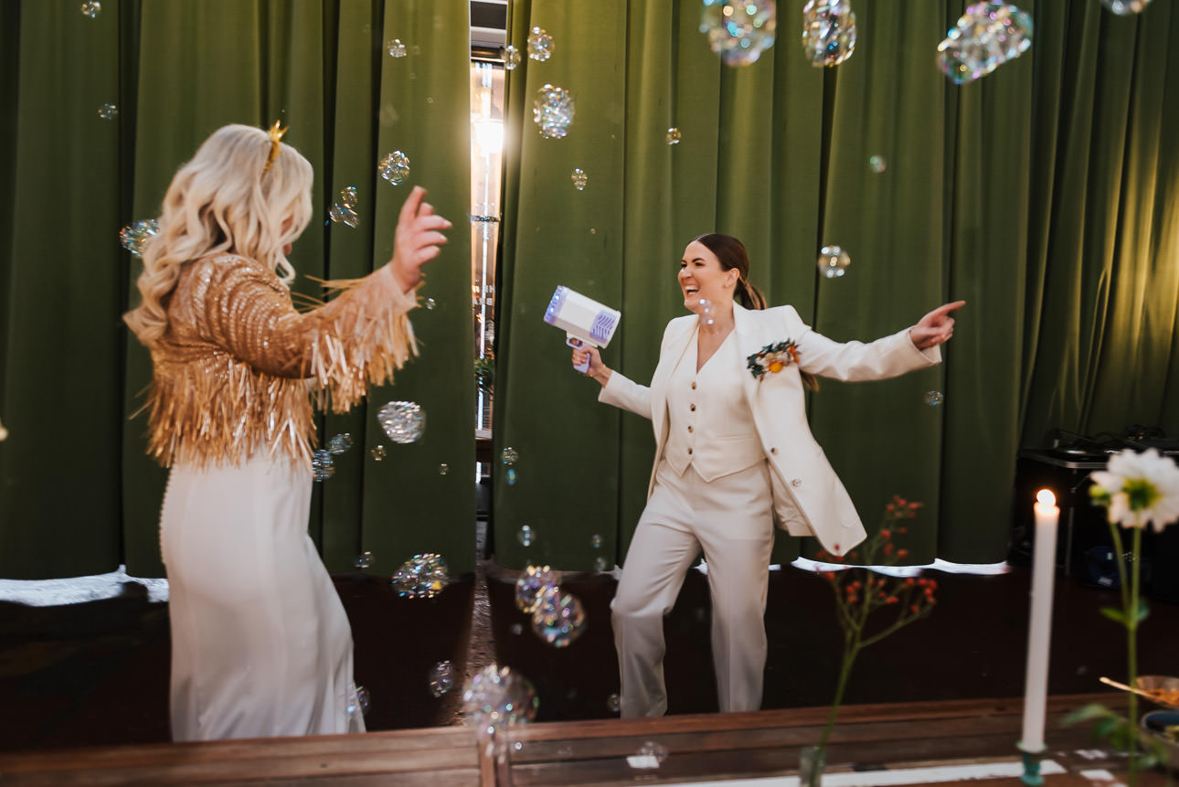 A couple entering the Mowbray with bubble guns
