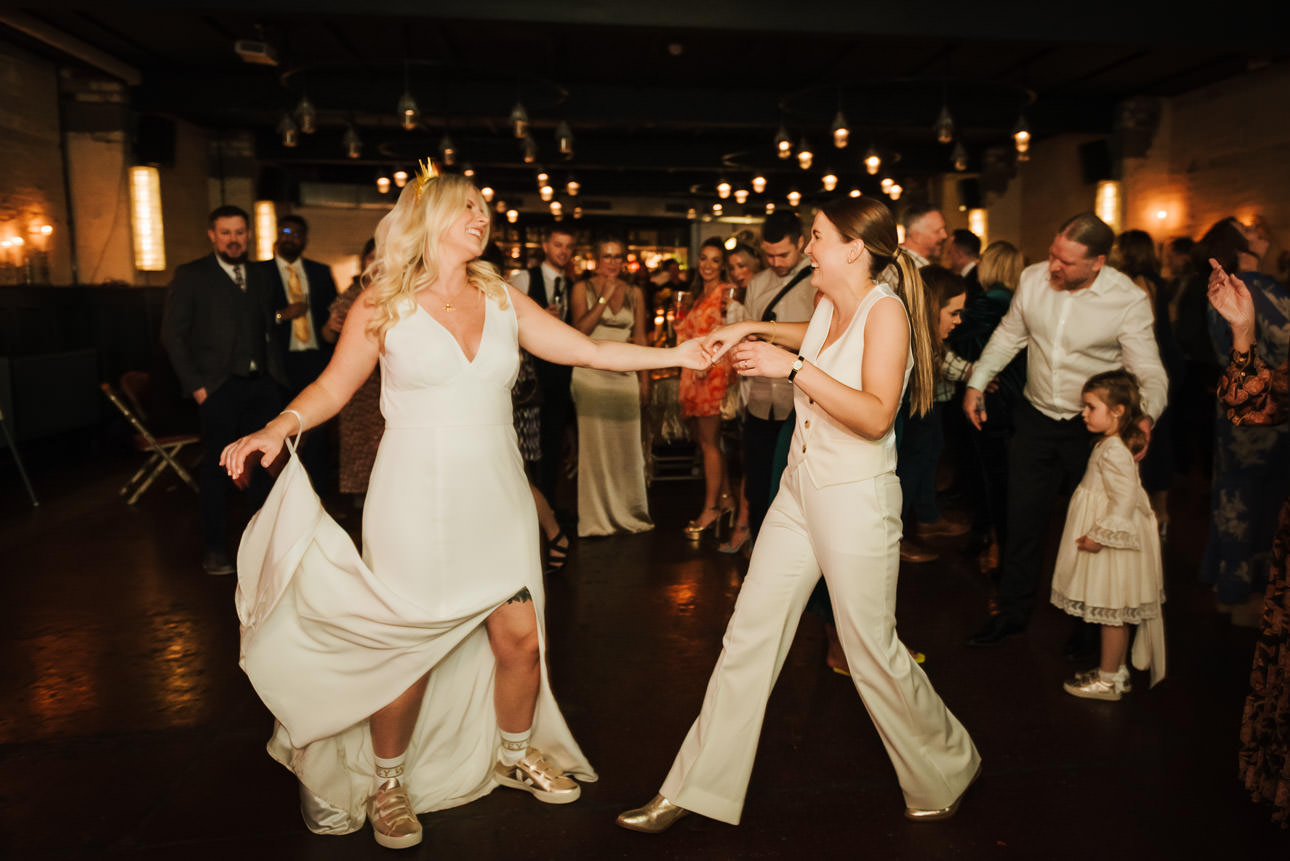 A lesbian couple having their first dance