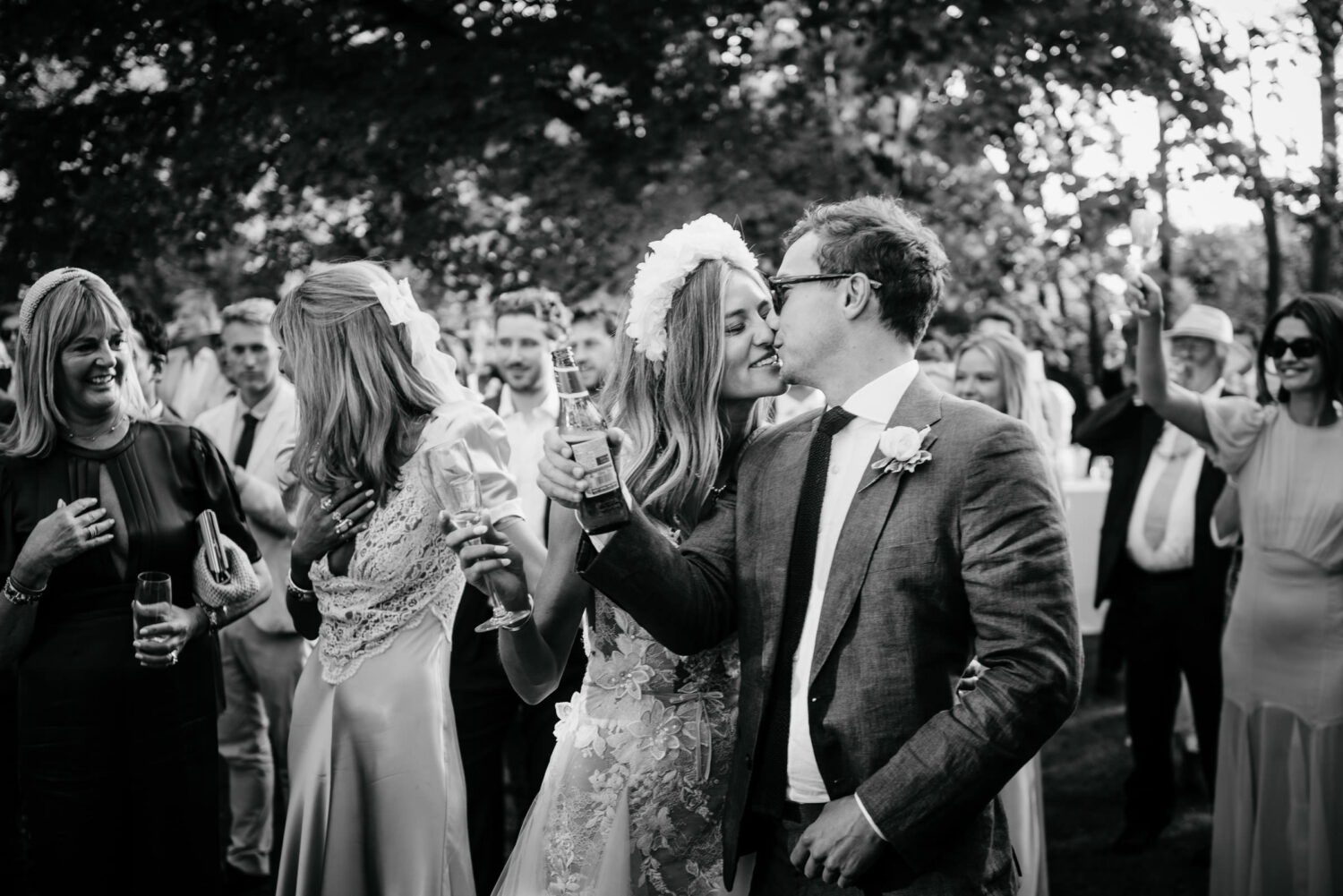 A couple kissing after their wedding
