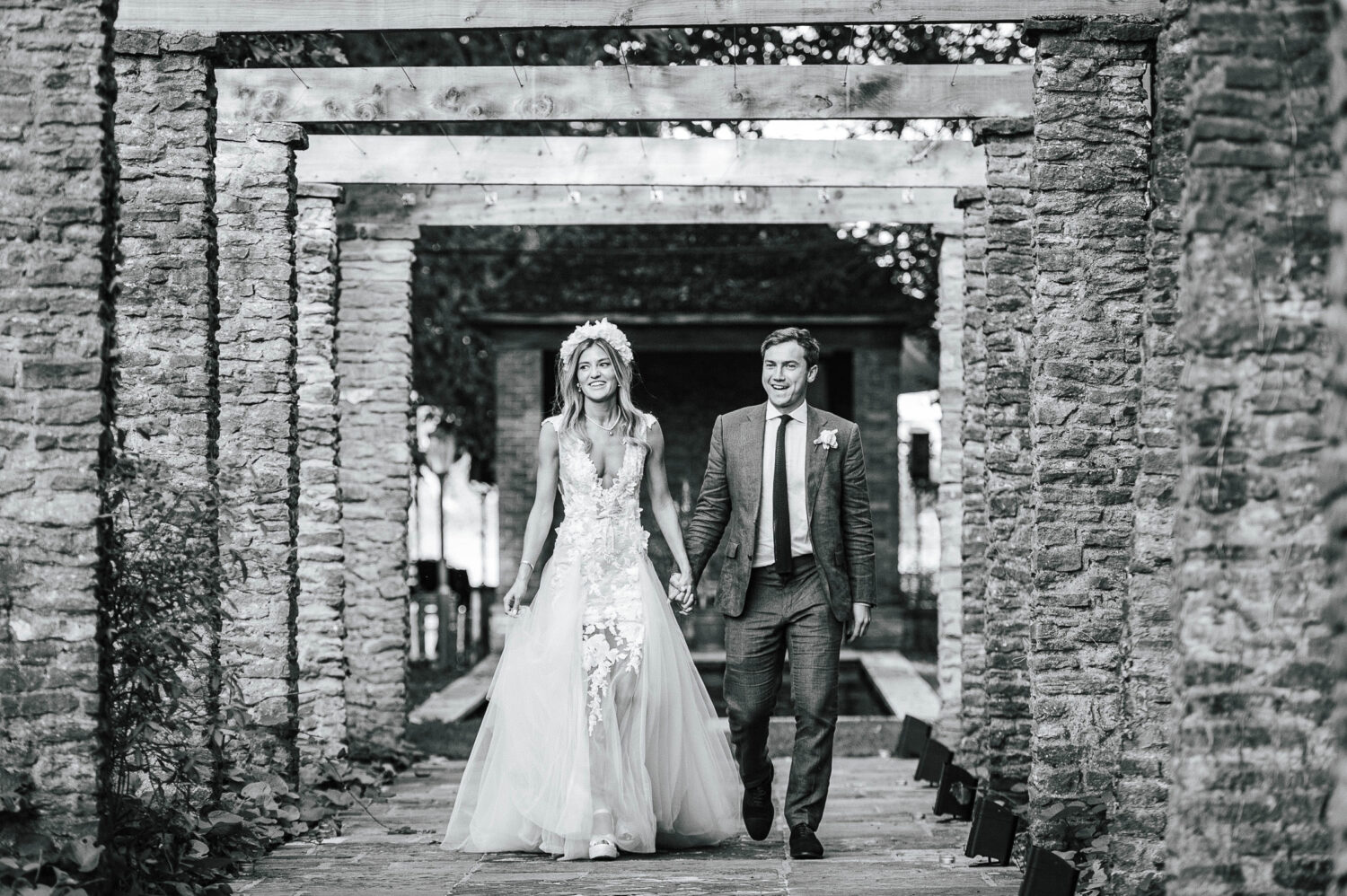 Lily and Jack walking to their wedding breakfast