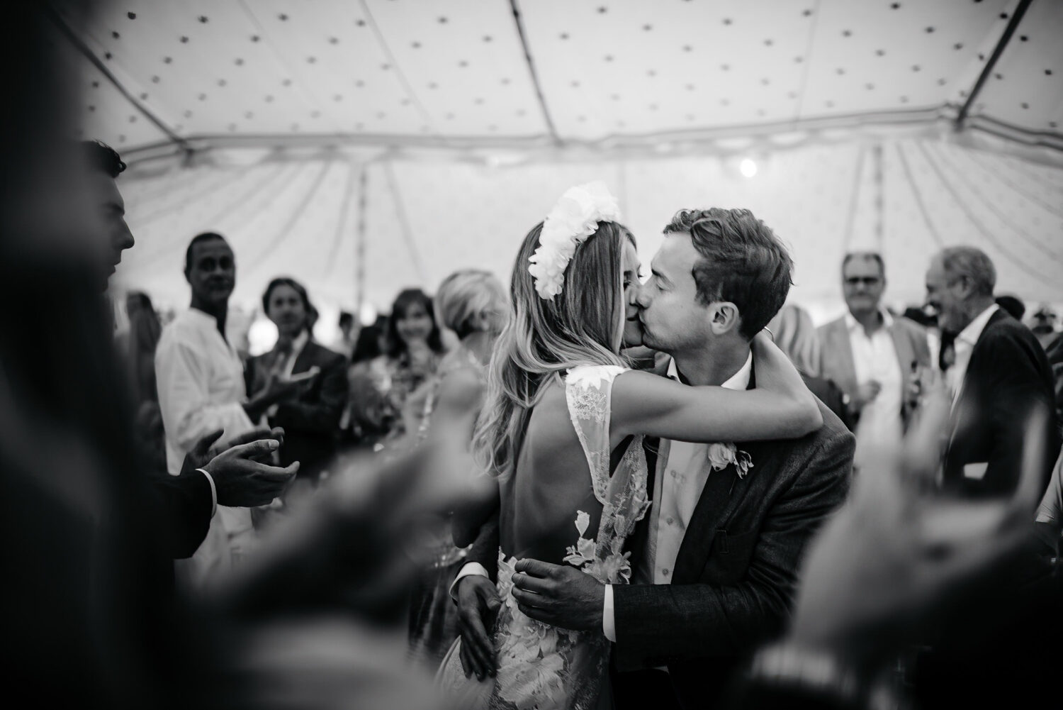 a couple kissing on their wedding day