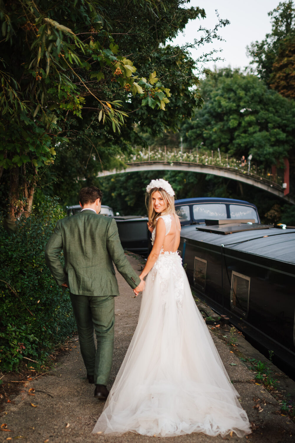 A beautiful bride looking over her shoulder whilst walking away