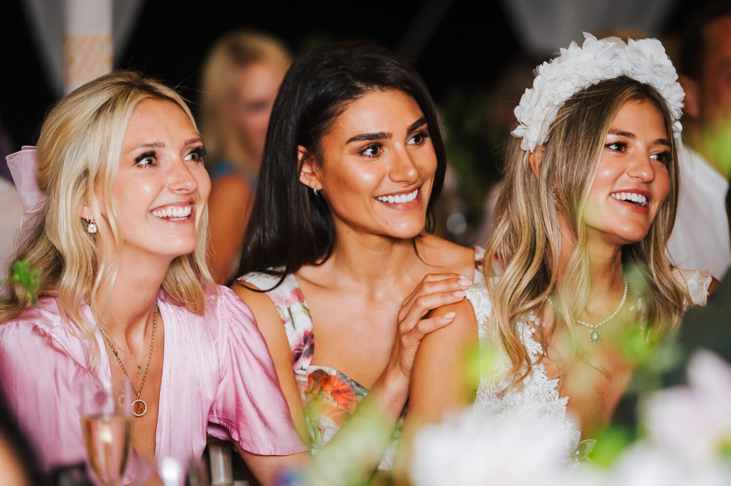 Bridesmaids listening to the speeches
