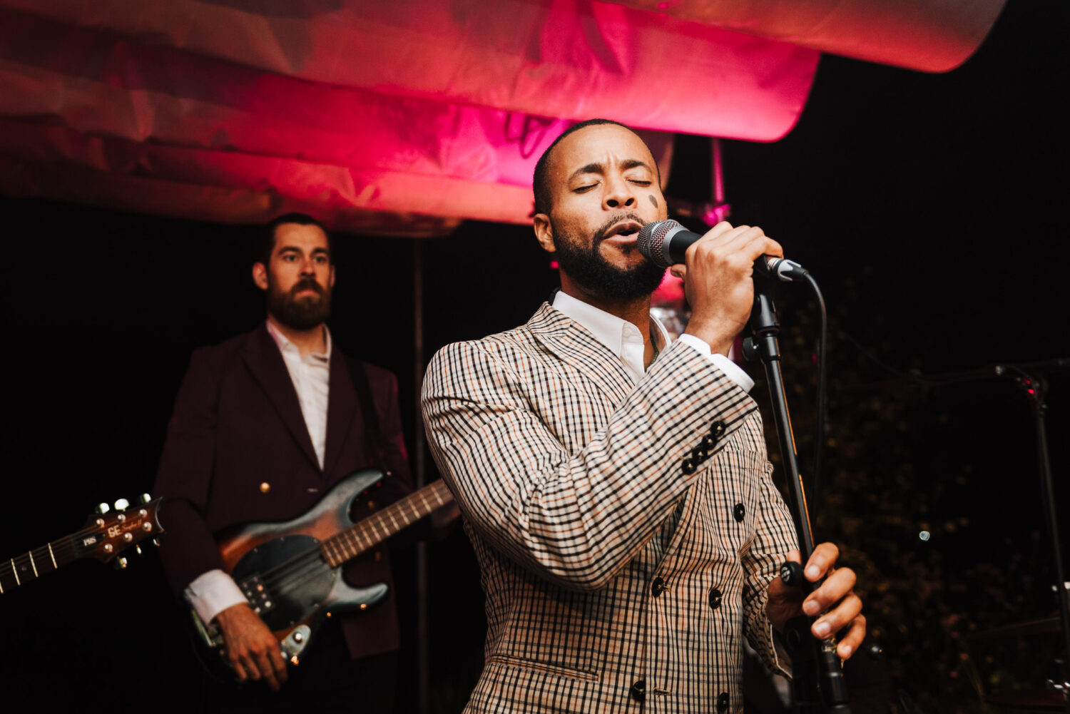 A band singing in sharp suits