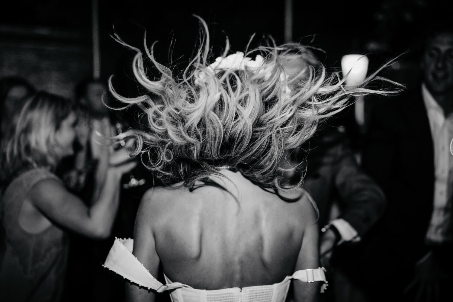 A bride's wild hair flying around whilst dancing