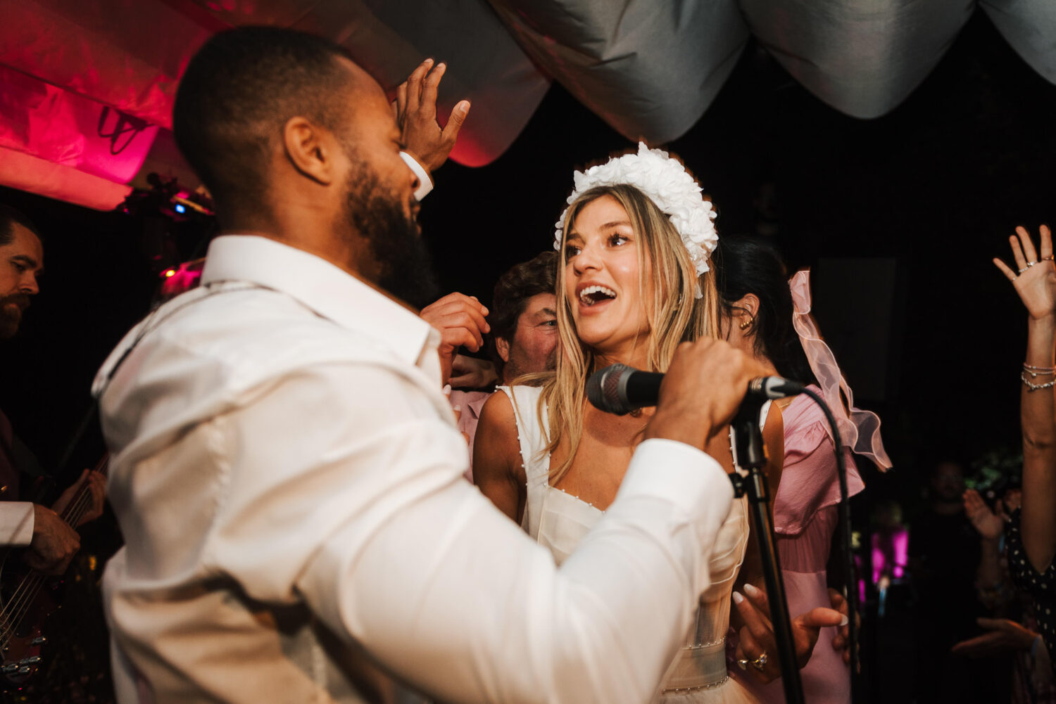A bride singing with the wedding band