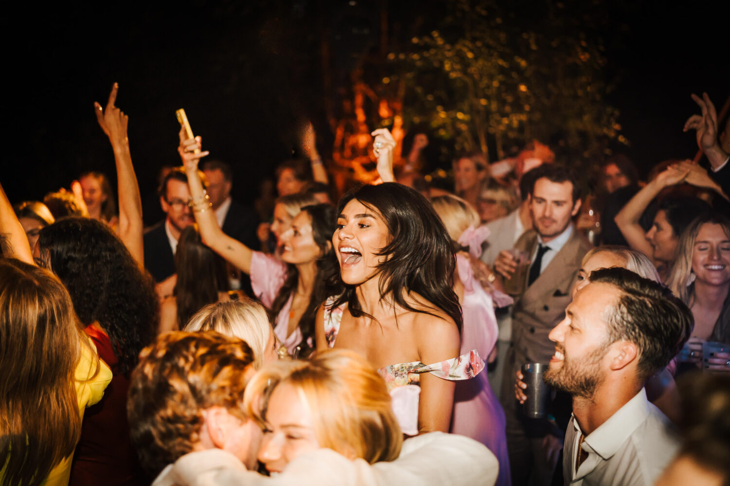 Wedding guests dancing to the band