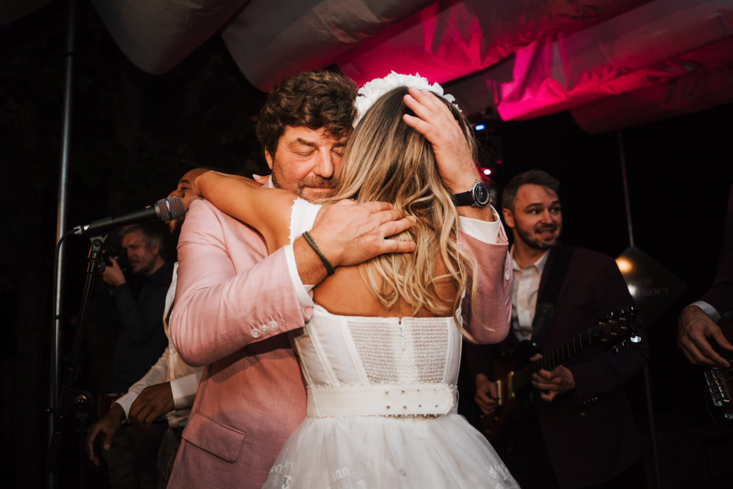 The father of the bride hugging his daughter