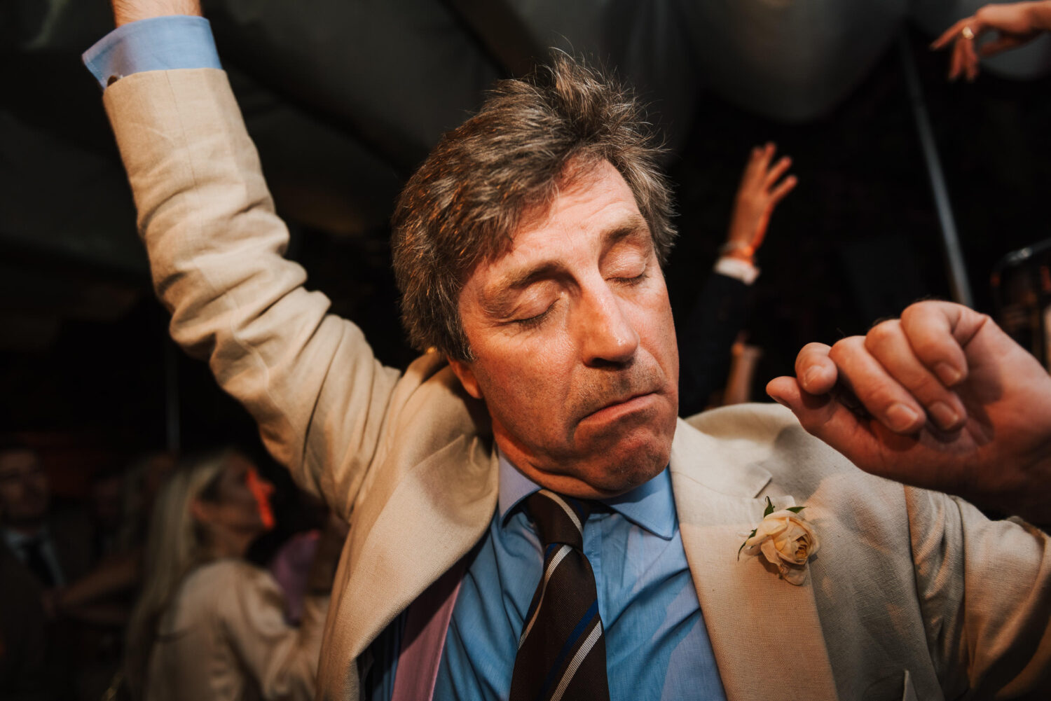 A man dancing at a wedding in London